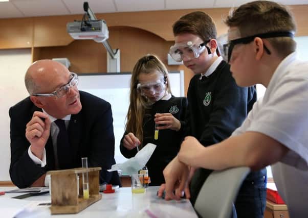 New Education Secretary John Swinney during a visit to his former school,  Forrester High School. Picture: PA