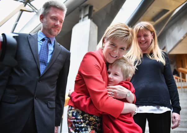 Gregg, Kathryn and Lachlan Brain have won a reprieve over their deportation. They won support from Scotland's First Minister Nicola Sturgeon and their local communities. Picture: Jeff J Mitchell/Getty Images