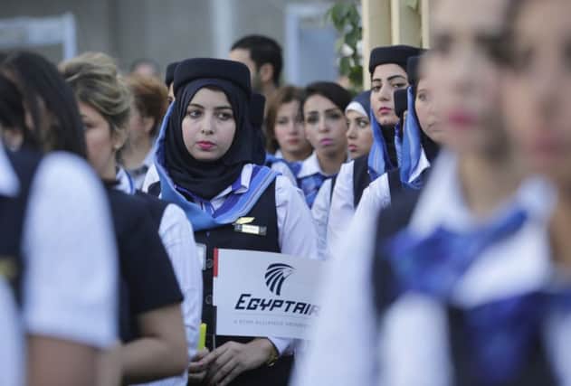 EgyptAir hostess line up during a candlelight vigil for the victims of EgyptAir flight 804 in Cairo. Picture: AP