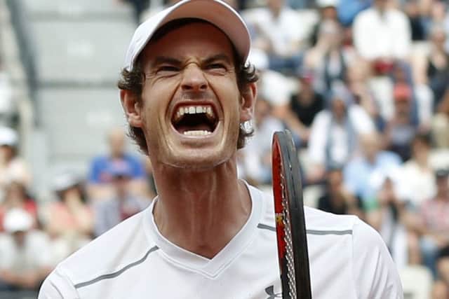 Andy Murray reacts as he defeats Croatia's Ivo Karlovic in the third round of the French Open. Picture: Alastair Grant/AP