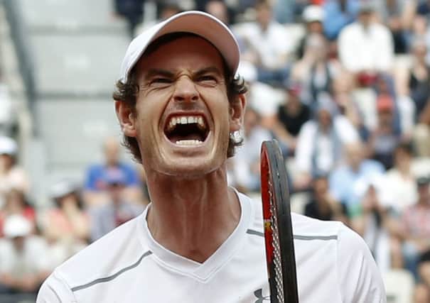 Andy Murray reacts as he defeats Croatia's Ivo Karlovic in the third round of the French Open. Picture: Alastair Grant/AP