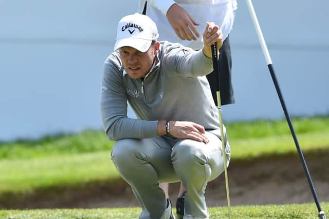 Danny Willett lines up a putt on the 18th green at Wentworth. Picture: Getty.