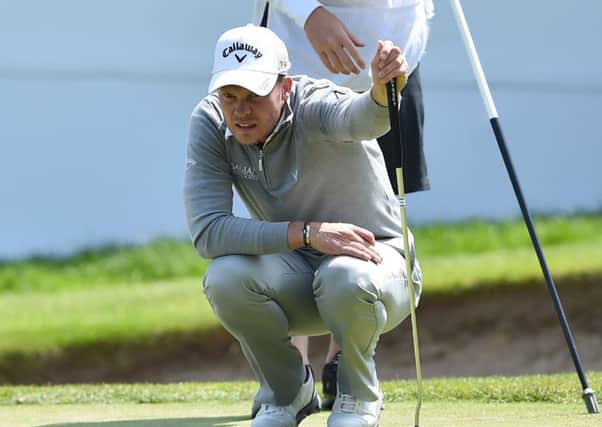 Danny Willett lines up a putt on the 18th green at Wentworth. Picture: Getty.