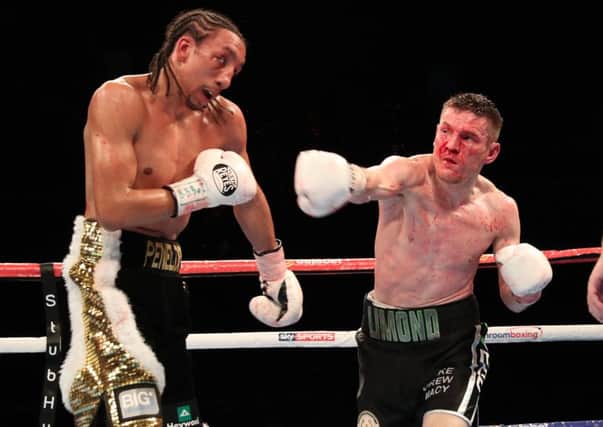Willie Limond throws a right at Tyrone Nurse, but it was to no avail, the fight was stopped in the ninth. Picture: Steve Welsh