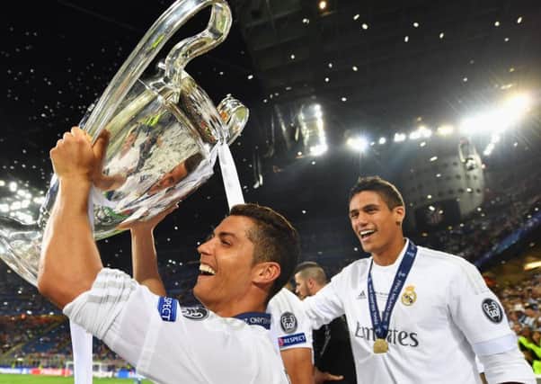 Cristiano Ronaldo celebrates with the trophy following the penalty shoot-out decider in Milan. Picture: Getty Images