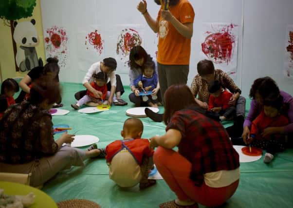 Children attend art class in the Chinese capital Beijing, where more families are turning to IVF so they can have another child. Picture: AP