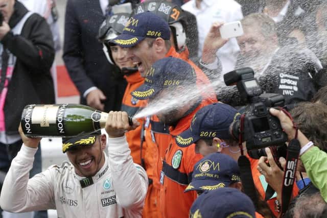 Lewis Hamilton celebrates after winning the Monaco Grand Prix. Picture: AP