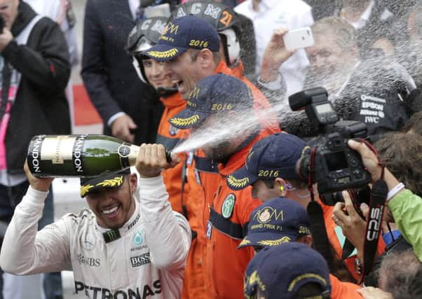 Lewis Hamilton celebrates after winning the Monaco Grand Prix. Picture: AP