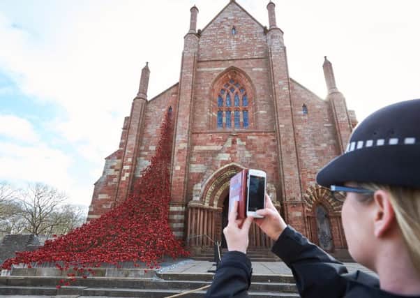 The poppy sculpture Weeping Window cascades down the side of St Magnus Cathedral. Picture: Getty Images