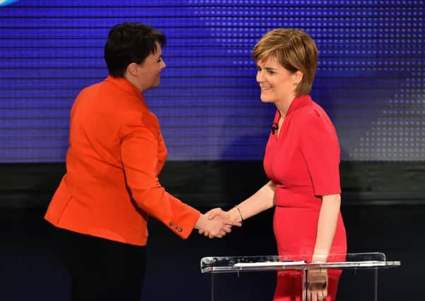 First Minister and SNP leader Nicola Sturgeon shakes hands with Tory leader Ruth Davidson following a television debate. Picture: Getty Images