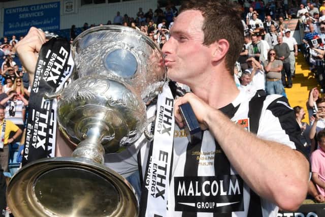 Richard Burke, scorer of the decisive penalty, with the trophy. Picture: SNS Group