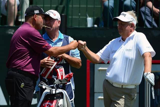 Rocco Mediate greets Colin Montgomerie on the first hole during the final round. Picture: Getty Images