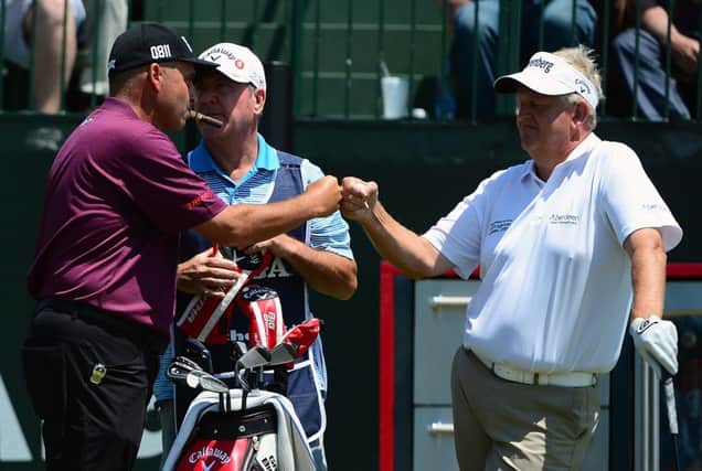 Rocco Mediate greets Colin Montgomerie on the first hole during the final round. Picture: Getty Images