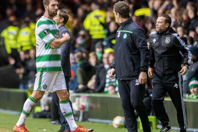 Injury forces Charlie Mulgrew to  leave the field in Celtics 2-1 home defeat by Ajax. Picture: SNS.