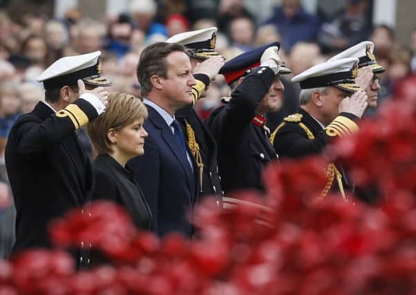 Prime Minister David Camerona and First Minister Nicola Sturgeon attend a service in Kirkwall, Orkney. Picture: PA