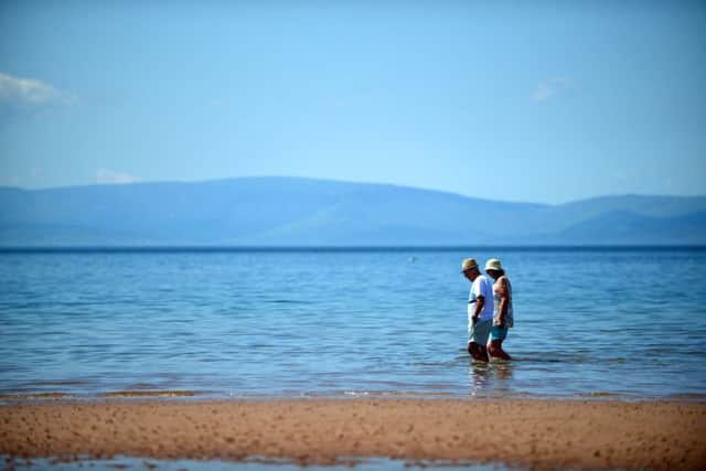 People cool off at the beach in West Kilbride, Ayrshire. Picture: SWNS