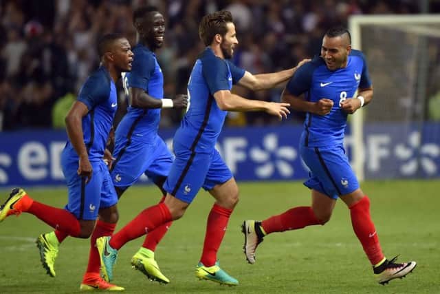 Striker Dimitri Payet, far right, celebrates with team-mates after his 90th-minute goal gave France a 2-1 friendly win over Cameroon in Nantes on Monday. Picture: Loic Vanance/Getty Images