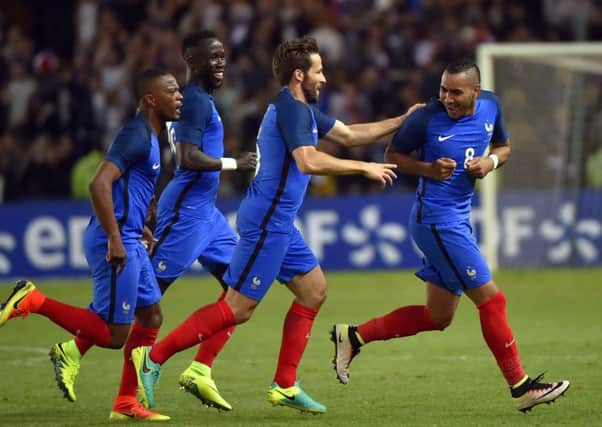 Striker Dimitri Payet, far right, celebrates with team-mates after his 90th-minute goal gave France a 2-1 friendly win over Cameroon in Nantes on Monday. Picture: Loic Vanance/Getty Images