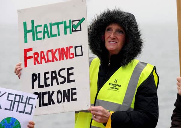 A campaigner protests against fracking last year. Picture: Lisa Ferguson