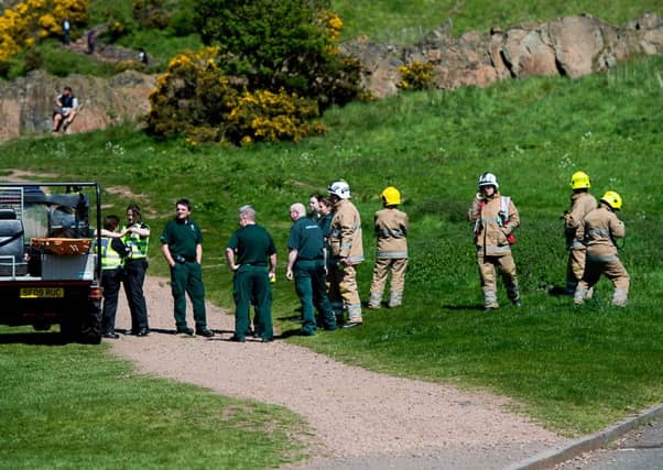 Emergency services in attendance at Arthur's Seat, where the woman fell. Picture: Wullie Marr