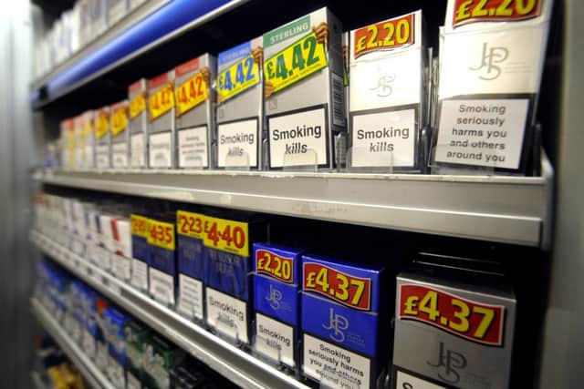 Cigarettes and tobacco products on display behind the counter of a newsagents in 2010. Picture: Jane Barlow