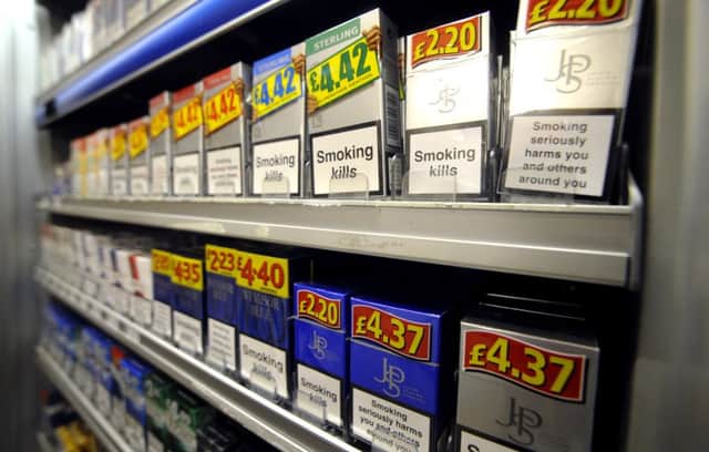 Cigarettes and tobacco products on display behind the counter of a newsagents in 2010. Picture: Jane Barlow
