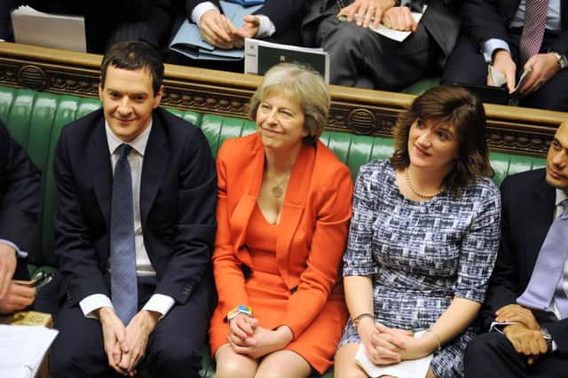 Home Secretary Theresay May, centre. Picture: PA