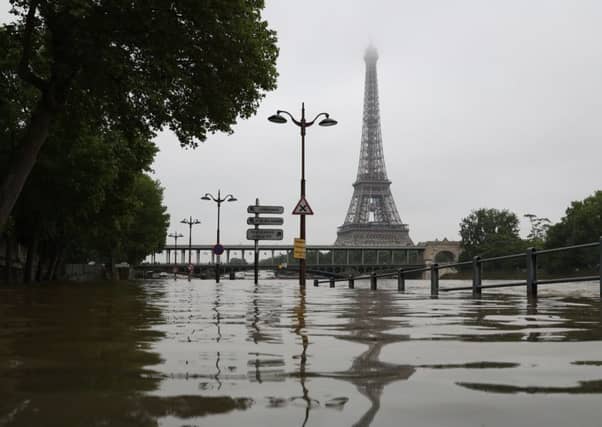 Firefighters evacuate people in a small boat south of Paris. Picture: AFP/Getty Images