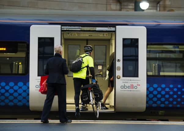 Workers are being balloted over whether conductors or drivers should check that doors are clear and close them so the train can depart. Picture: John Devlin