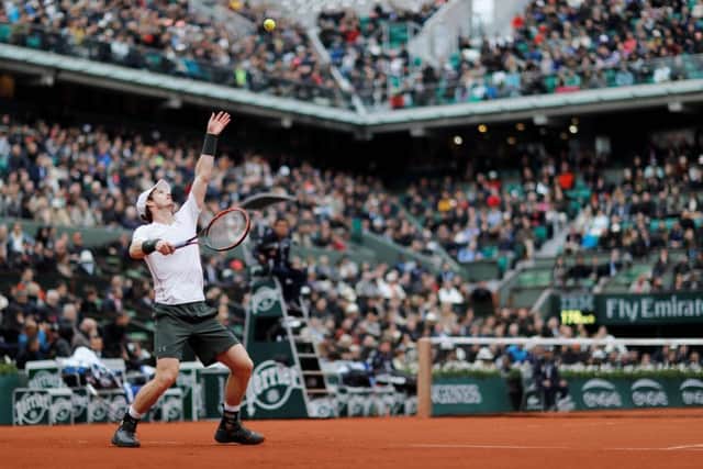 Andy Murray serves the ball to Switzerland's Stanislas Wawrinka during their men's semi-final match at the Roland Garros 2016 French Tennis Open. Picture: Getty Images