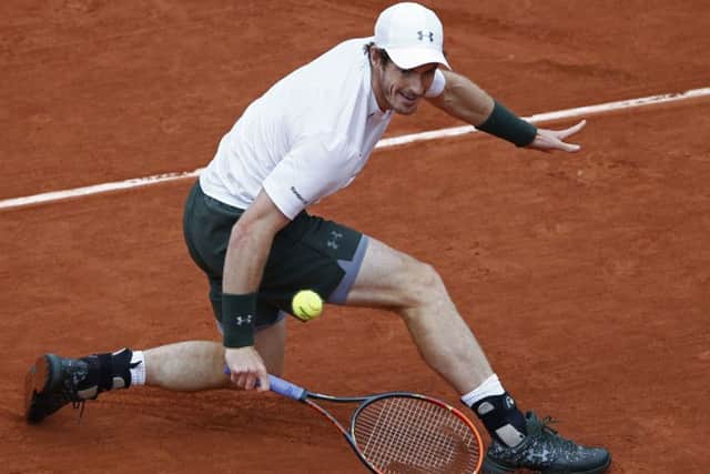 Andy Murray returns the ball en route to victory over Stan Wawrinka in the French Open semi-final. Picture: Christophe Ena/AP