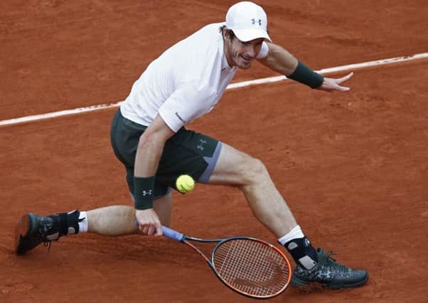 Andy Murray returns the ball en route to victory over Stan Wawrinka in the French Open semi-final. Picture: Christophe Ena/AP