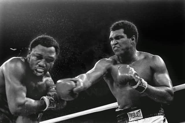 Muhammad Ali connects with a right against Joe Frazer in their title fight in Manila. Picture: AP