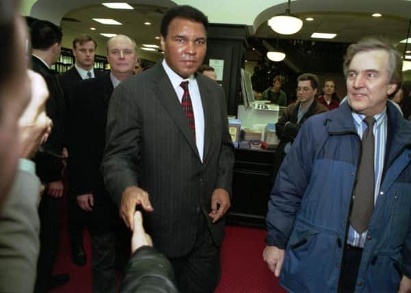 Muhammad Ali arrives at Waterstone's book shop in Edinburgh, for a book signing in November 1993. Picture; TSPL