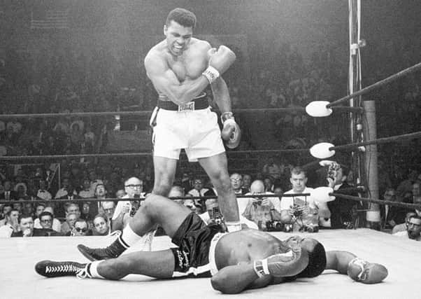 Muhammad Ali stands over Sonny Liston after dropping the challenger with a short hard right to the jaw, in Lewiston, Maine, in 1965, in one of his most controversial fights.
 Picture: John Rooney/AP