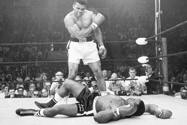 Muhammad Ali stands over Sonny Liston after dropping the challenger with a short hard right to the jaw, in Lewiston, Maine, in 1965, in one of his most controversial fights.
 Picture: John Rooney/AP