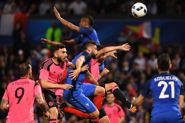 Olivier Giroud heads the ball just before Laurent Koscielny scores. Picture: Getty