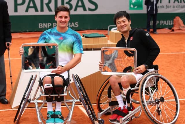 Consolation for Gordon Reid and Shingo Kunieda as they pose with their Men's Wheelchair doubles trophies. Picture: Getty Images