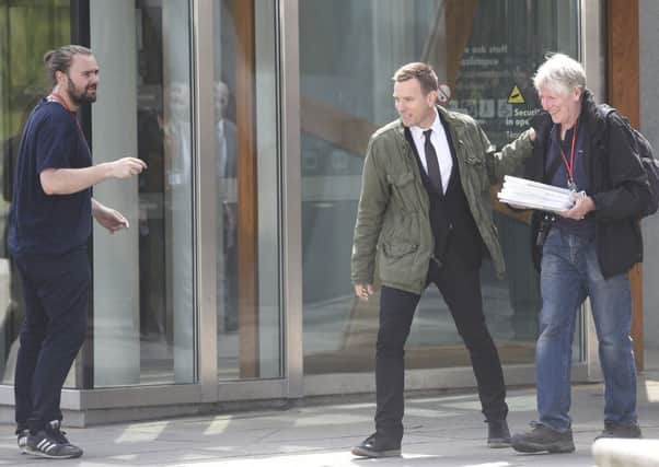 Ewan McGregor spotted filming at the Scottish Parliament. Picture: Greg Macvean