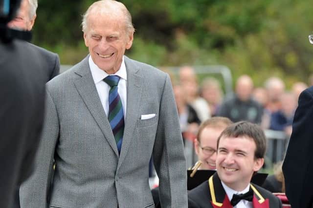 Duke of Edinburgh shares a joke with a member of St Davids Brass Band at Tweedbank.