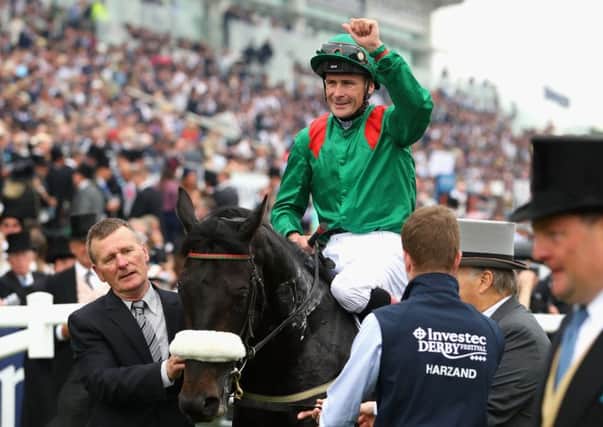 Pat Smullen pumps his fist in delight after guiding Harzand to victory in Saturdays Investec Derby. It was my greatest day in racing said the jockey afterwards. Picture: Getty