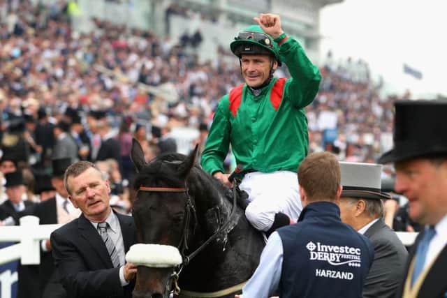 Pat Smullen pumps his fist in delight after guiding Harzand to victory in Saturdays Investec Derby. It was my greatest day in racing said the jockey afterwards. Picture: Getty