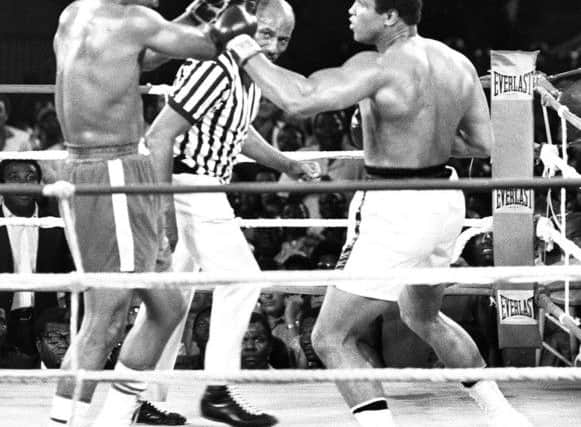 Ali and George Foreman slug it out during their epic eight-round battle in Zaire. Picture: Getty