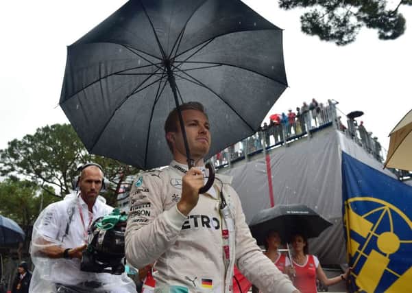 Mercedes driver Nico Rosberg walks on the grid at the Monaco street circuit. Picture: ANDREJ ISAKOVIC/AFP/GETTY