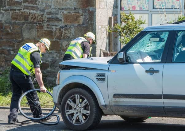 Police at the scene on Burnshot Road in Dalmeny where a cyclist was killed. Picture: Ian Georgeson
