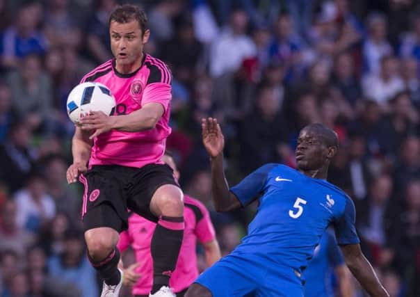 Scotlands Shaun Maloney beats NGolo Kante to the ball in Metz on Saturday, a night when the visitors were outclassed.