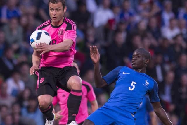 Scotlands Shaun Maloney beats NGolo Kante to the ball in Metz on Saturday, a night when the visitors were outclassed.
