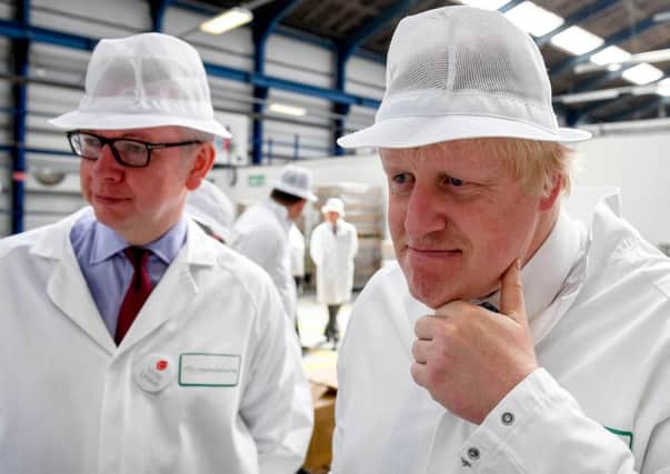 Michael Gove and Boris Johnson on a business visit for Vote Leave this week. Many firms feel they are lacking solid facts on EU membership. Picture: Getty Images