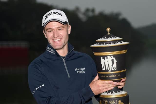 Russell Knox  with the winners trophy after the final round of the WGC - HSBC Champions at the Sheshan International Golf Club in Shanghai. Picture: Ross Kinnaird/Getty
