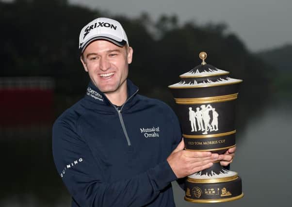 Russell Knox with the winners trophy after the final round of the WGC - HSBC Champions at the Sheshan International Golf Club in Shanghai. Picture: Ross Kinnaird/Getty